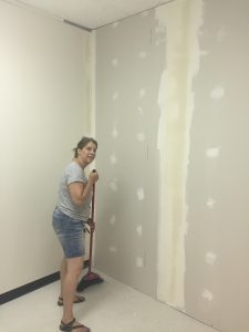 Sweeping the dust in the new office space at Conexus Counselling
