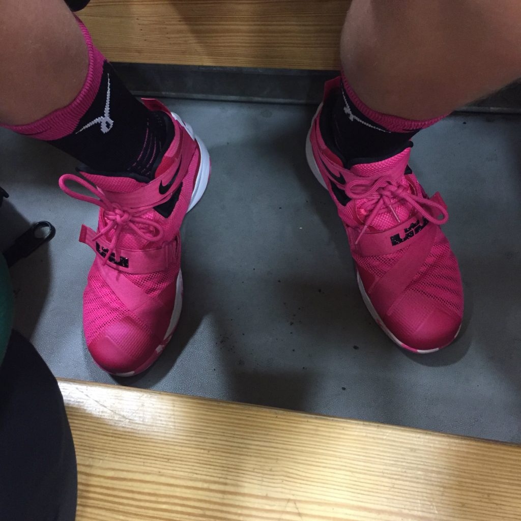 My Junior Tribe Member's fluorescent pink shoes