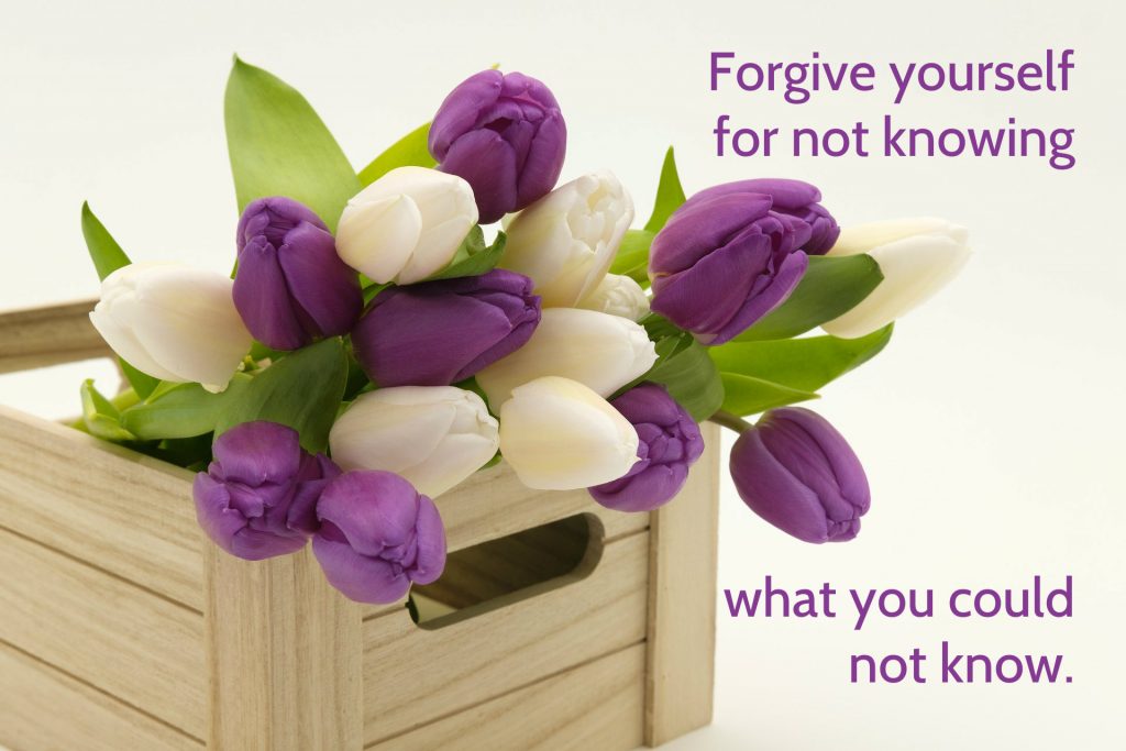 Forgive yourself for not knowing what you could not know quote on background of basket of spring tulips on blog about regret around not removing an icy patch that played a role in a tragedy.