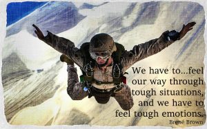We have to feel our way through tough situations and we have to feel tough emotions. Brené Brown quote on picture of man parachuting