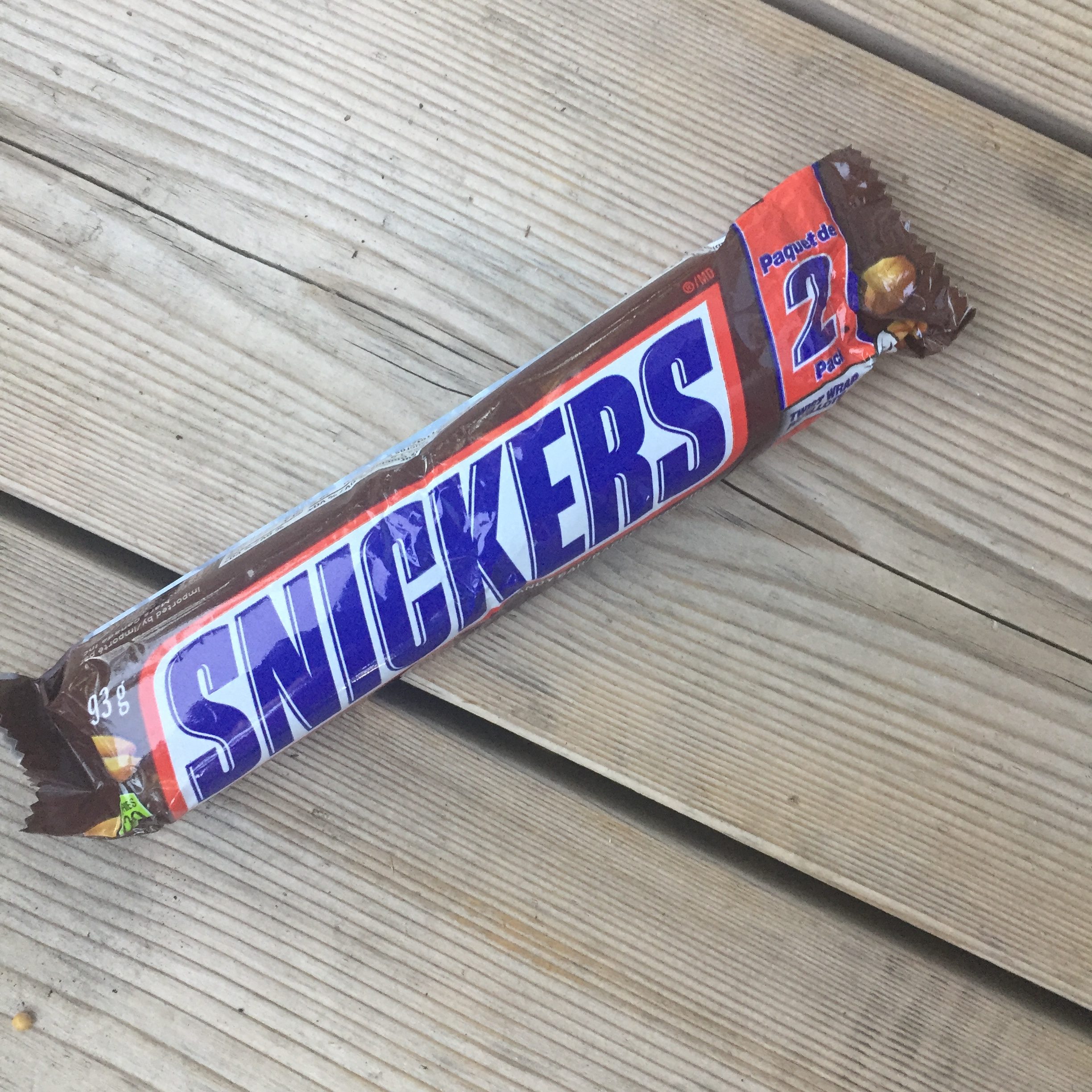 Snickers is Huband's favorte...and I didn't know. It reminded me about being deligent about the love map I have for Husband. Snickers bar on wood background