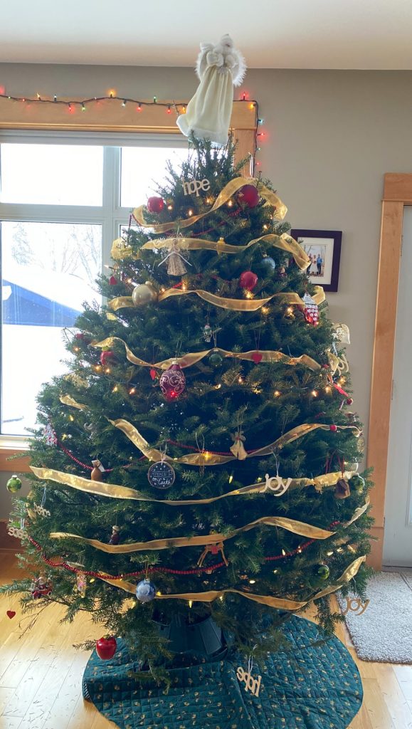 A full tree with lots of decorations looking like last year