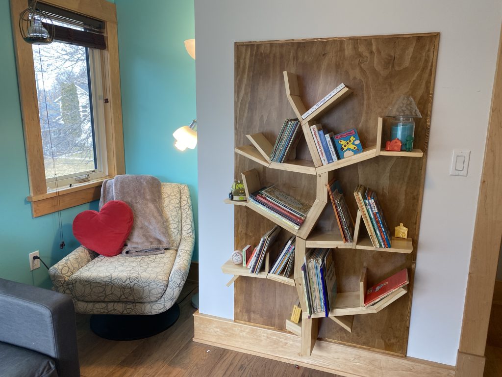 The book nook beside the book shelf for reading books with grandchildren